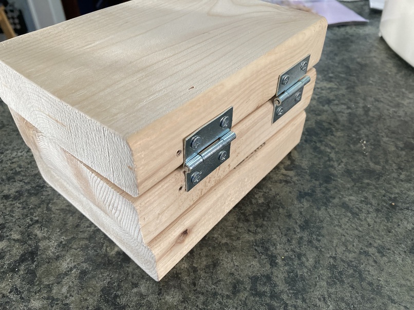 back side of the 2x6s; there are two hinges